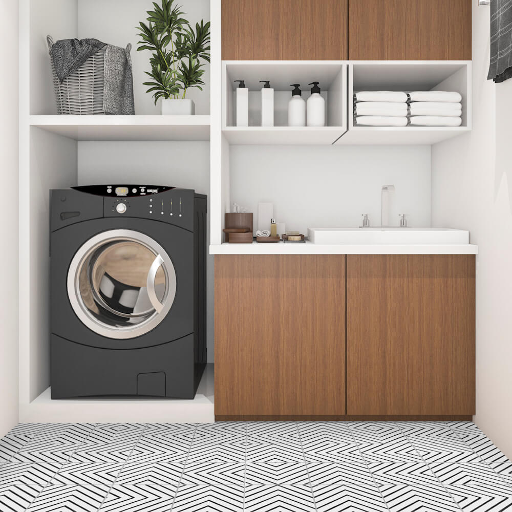 Modern laundry room featuring New York Cement Tile’s N20-437 B&W tiles, black washer, and wood cabinets for stylish utility.