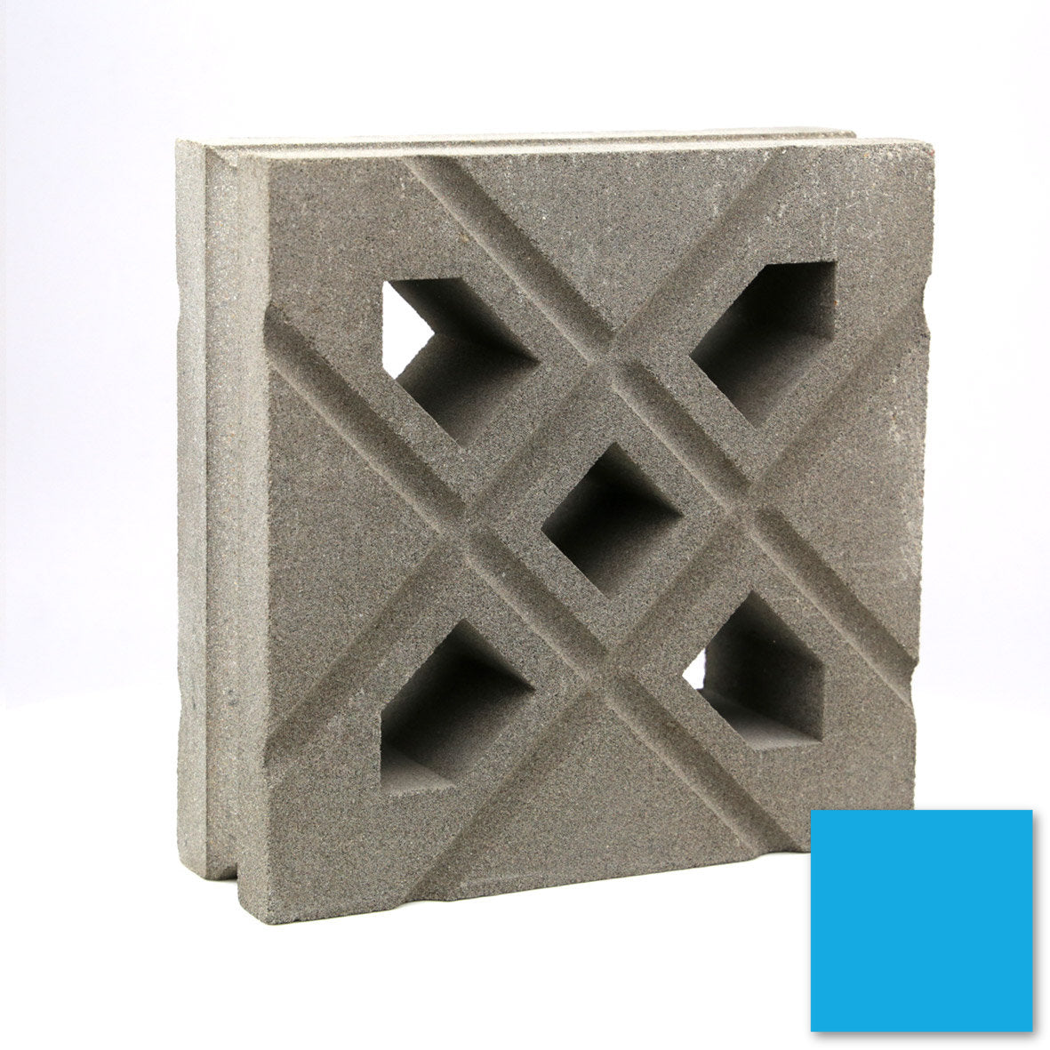 The Lana by New York Cement Tile, a gray block with geometric cut-outs, sits next to a small blue square.