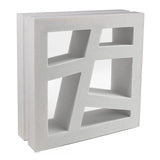 The Large Kyush by New York Cement Tile is a white breeze block with geometric cut-outs, ideal for mid-century designs.