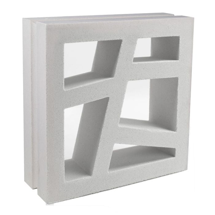 The Large Kyush by New York Cement Tile is a white breeze block with geometric cut-outs, ideal for mid-century designs.