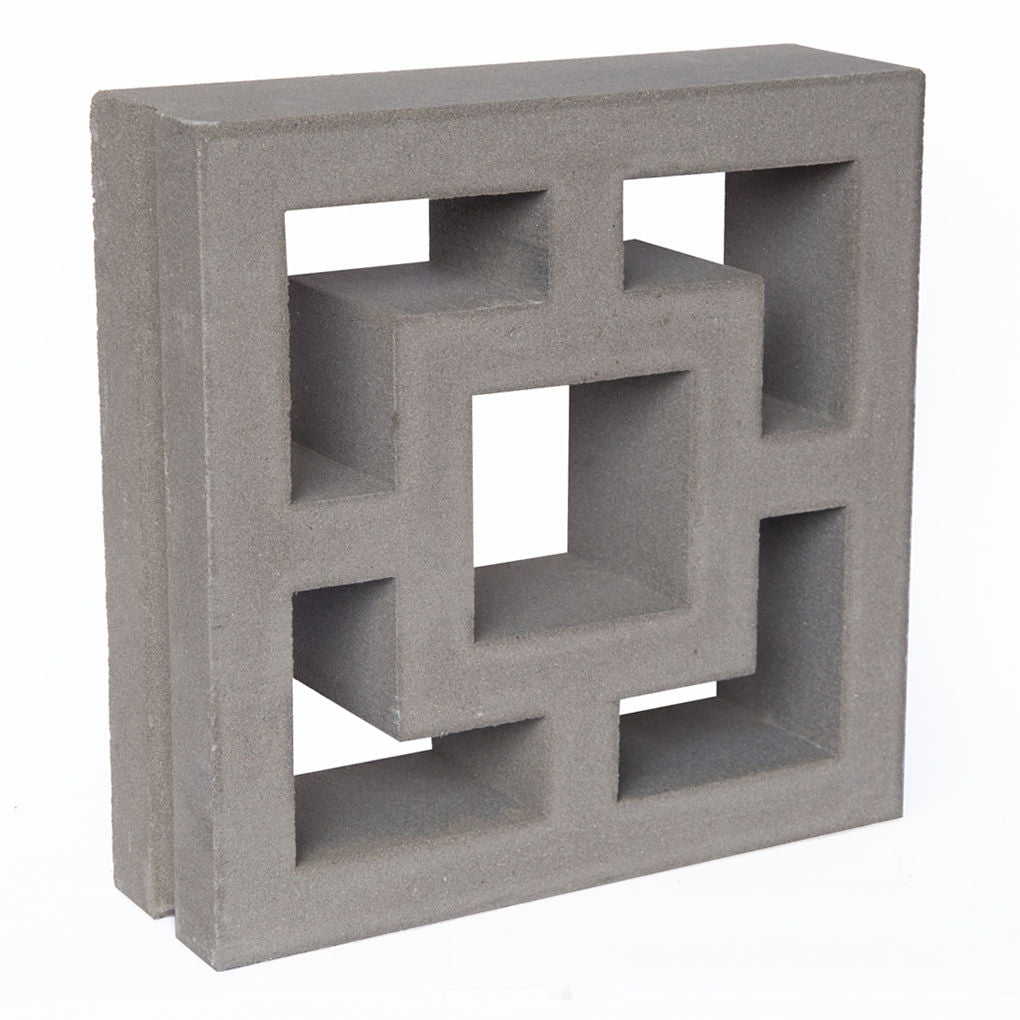 The Large Tong by New York Cement Tile is a gray geometric block, ideal for privacy screens or modern breeze block designs.