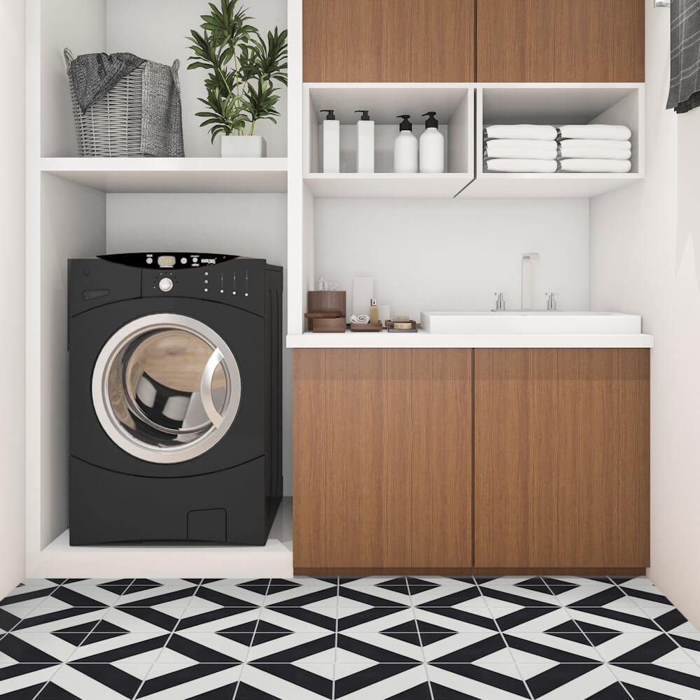Modern laundry room with black washer, wood cabinets, and N20-215 B&N by New York Cement Tile for durable flooring.