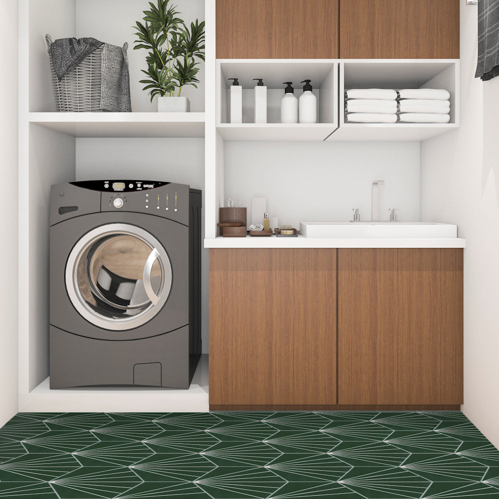 Modern laundry room with washer, sink, towels, plants, and NH23-036 green floor tiles by New York Cement Tile.