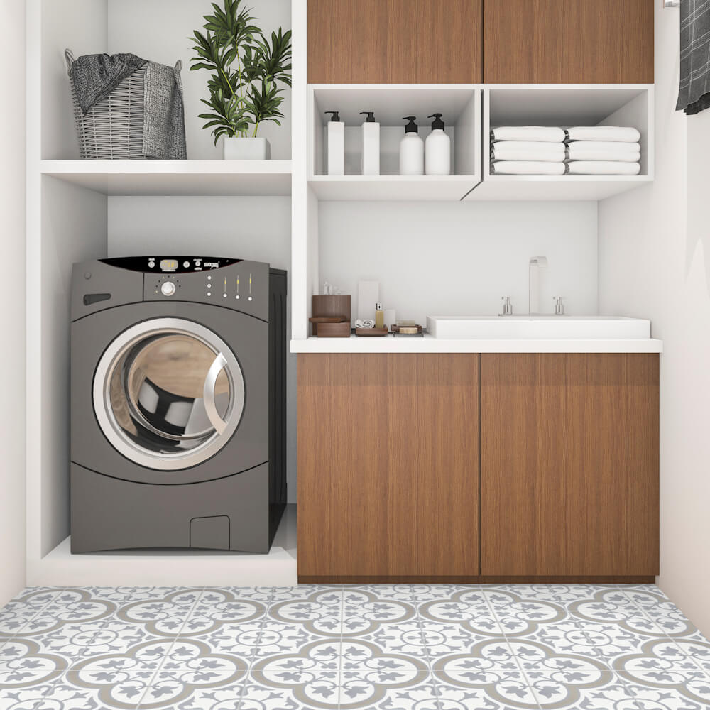 Modern laundry room featuring a front-load washer, wood cabinets, and New York Cement Tile's N20-045 Vintage Grey tiles.