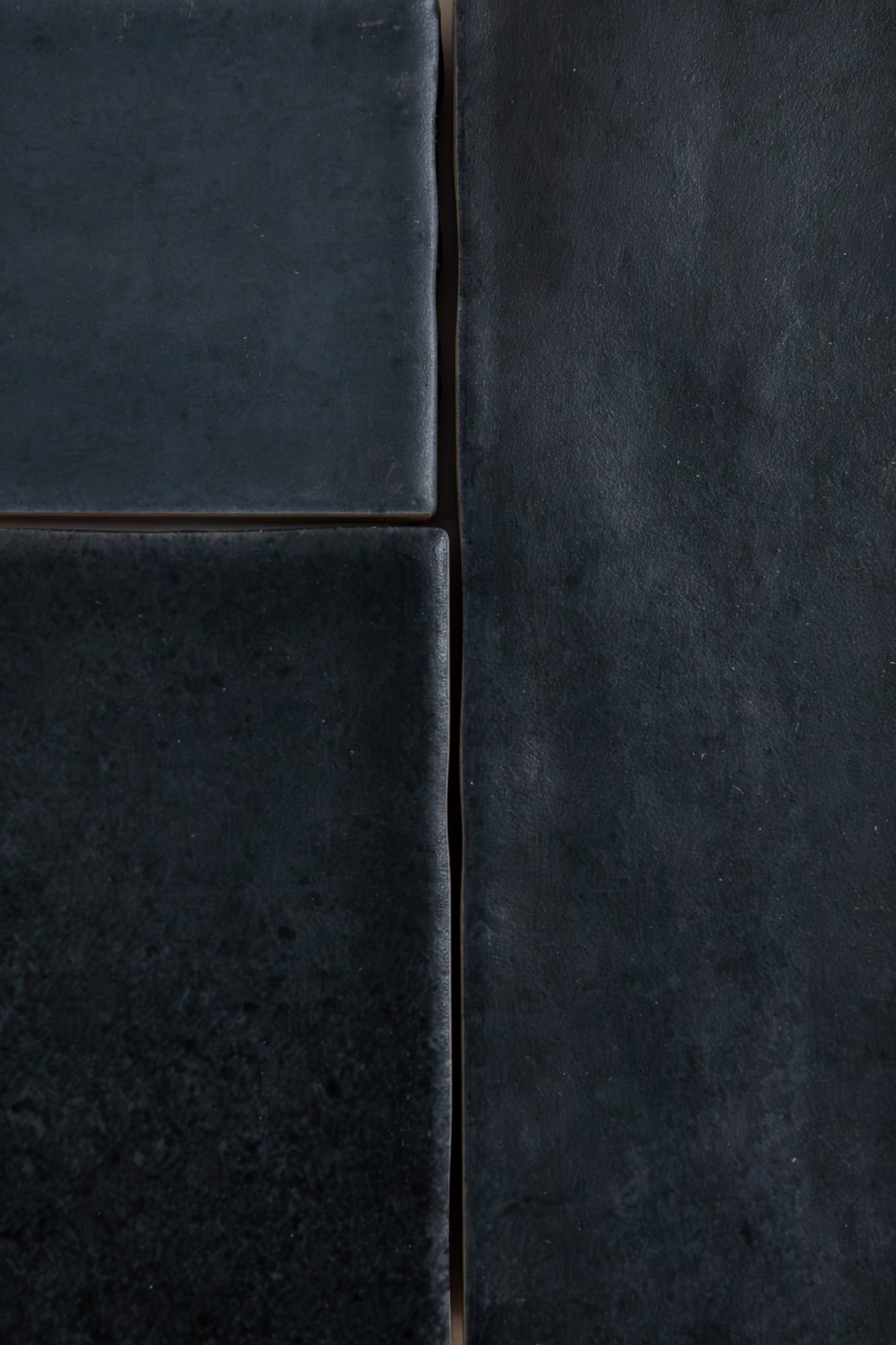 Close-up of four Lomond Blue, Extra Sample tiles by Cottage Ivy with matte texture and uneven edges in a rectangle layout.