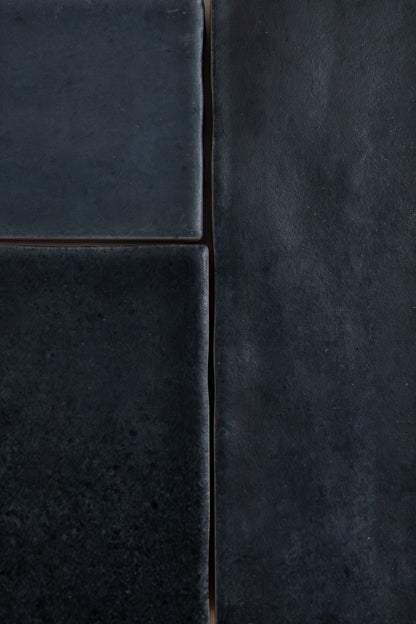 Close-up of four Lomond Blue, Extra Sample tiles by Cottage Ivy with matte texture and uneven edges in a rectangle layout.