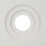 The Luzi Sample by New York Cement Tile features a textured white surface with two concentric grooves and a central hole.