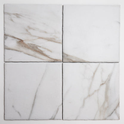 Four Macchia Vecchia, Extra Sample tiles by Tosca in a 2x2 grid; white marble with light grey and brown veining.