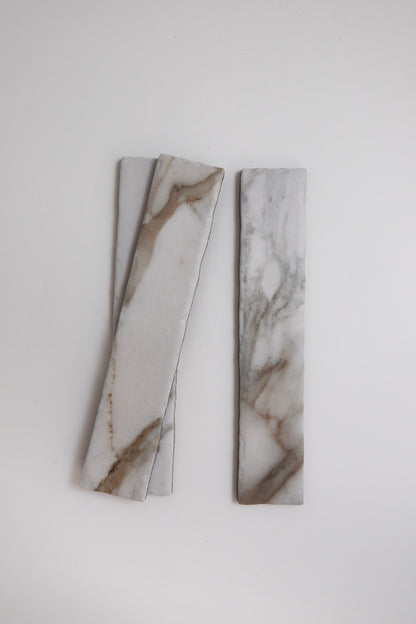 Two rectangular Macchia Vecchia, Extra Samples by Tosca with brown veins on light gray, set against a white background.