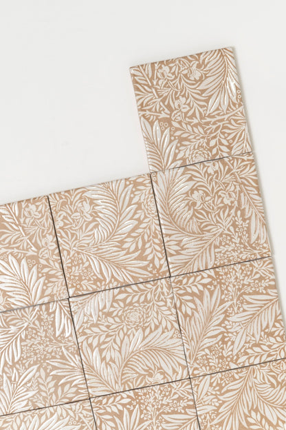 Nine Cottage Ivy Maisie Deco Extra Sample tiles, tan with white botanicals, one slightly offset on a white background.
