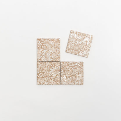 Four Maisie Deco Extra Sample tiles by Cottage Ivy—beige and white floral, three aligned, one slightly offset above.