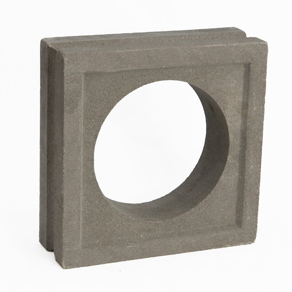 The Maldi by New York Cement Tile is a square gray block with a central hole, perfect for decorative screens or partitions.