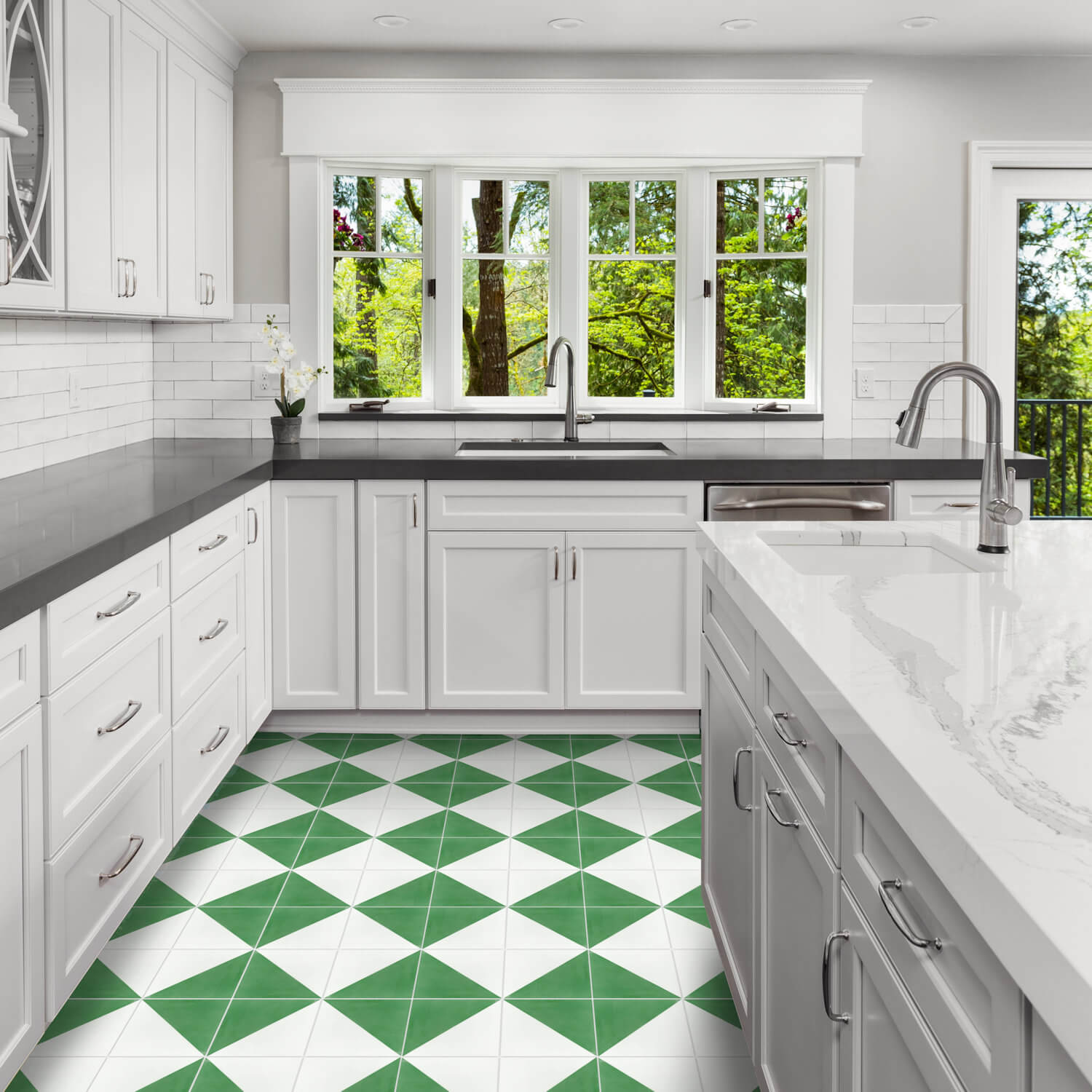 Bright kitchen with white cabinets, gray counters, large windows, and New York Cement Tile N20-139 Green & White floor tiles.
