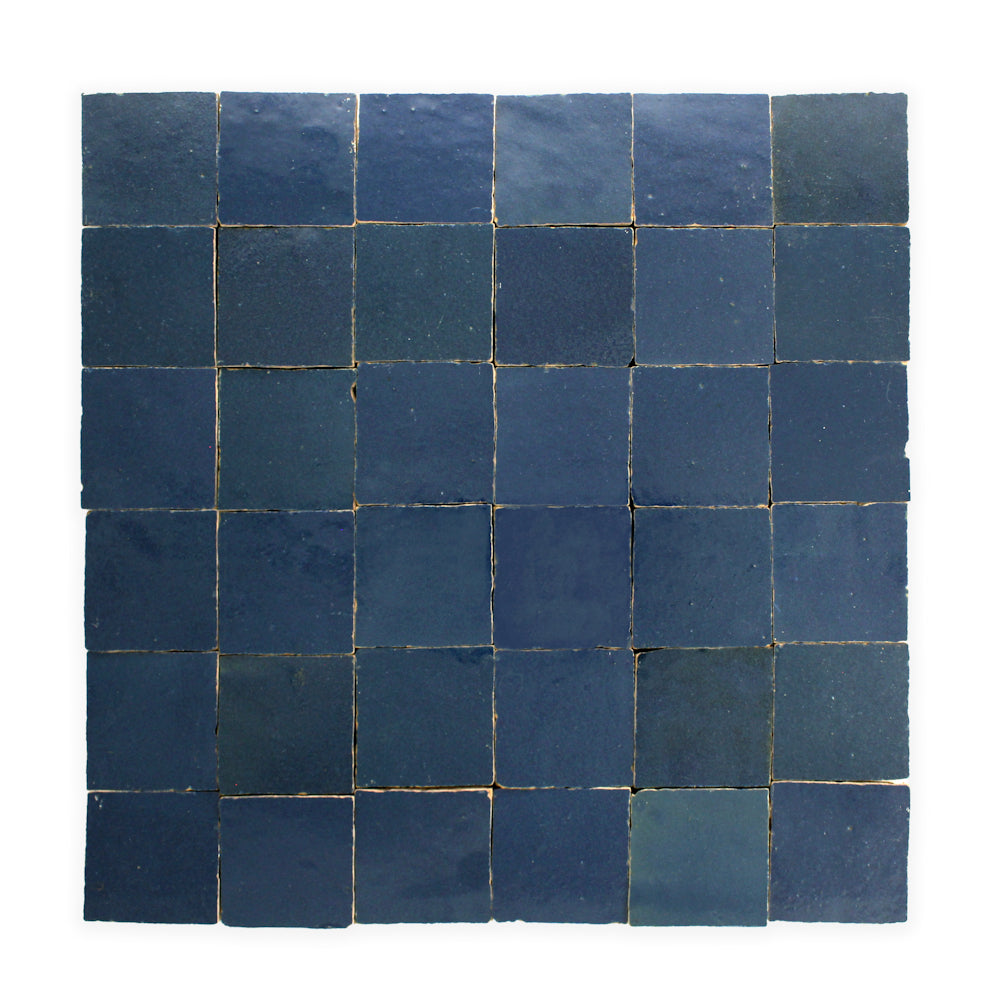 A square grid of Navy Depths 2X2 tiles by New York Cement Tile, each handcrafted with unique shade and texture.