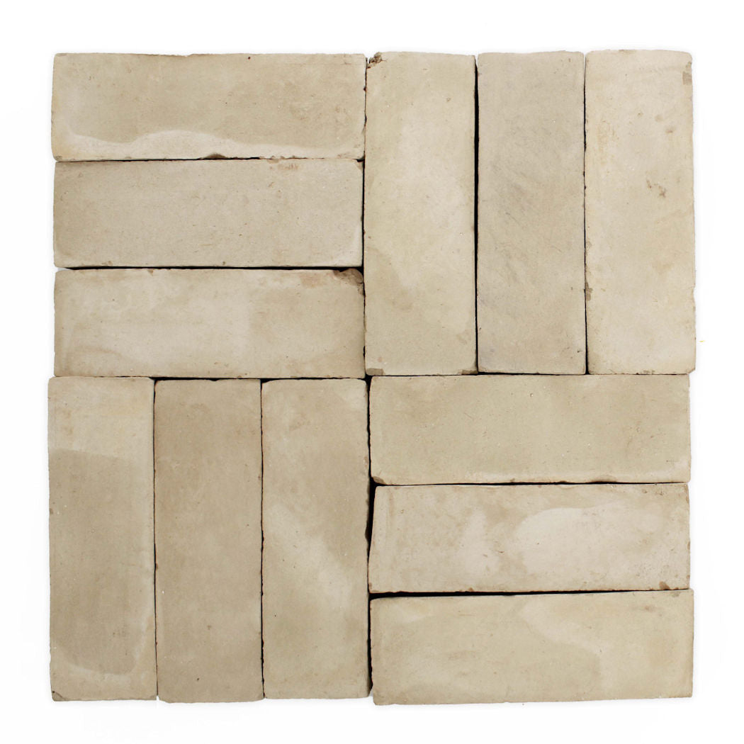 Four sets of Earthy Clay (2x6) by New York Cement Tile arranged in alternating rows for a stylish square pattern.