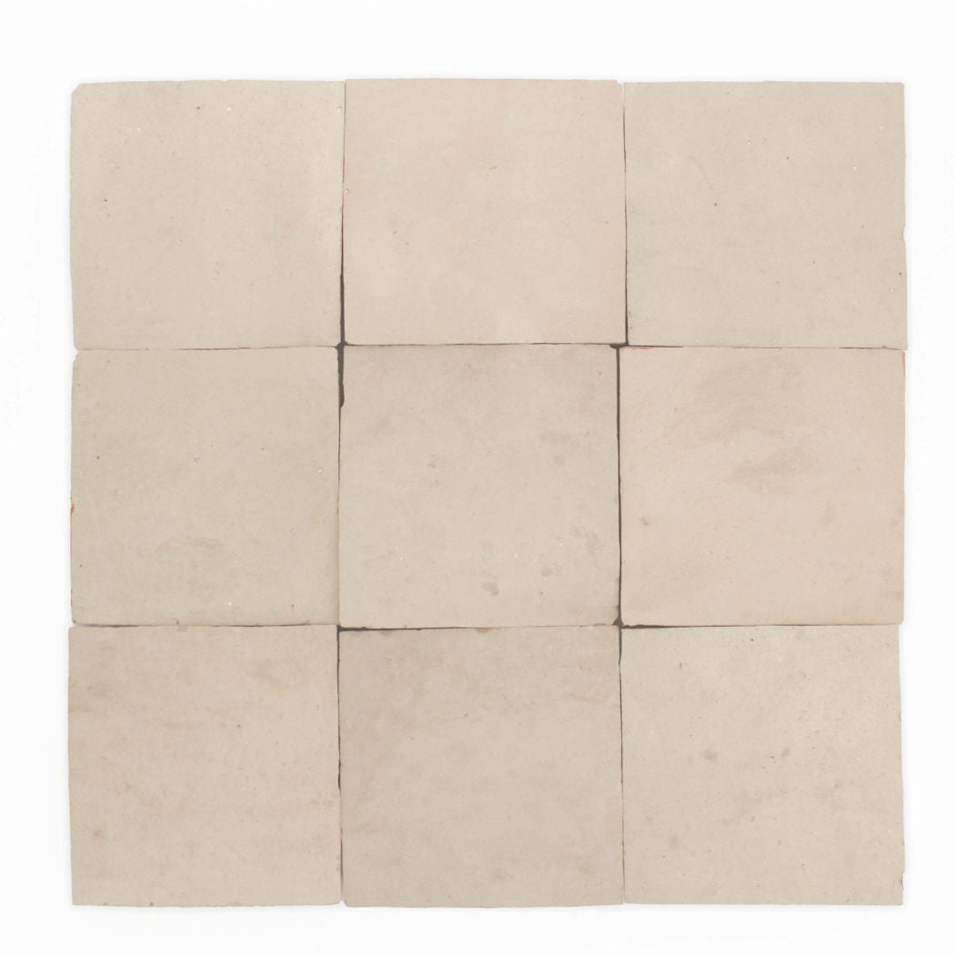 Nine Earthy Clay 2x2 tiles by New York Cement Tile in a 3x3 grid, with subtle beige tones and handcrafted texture.