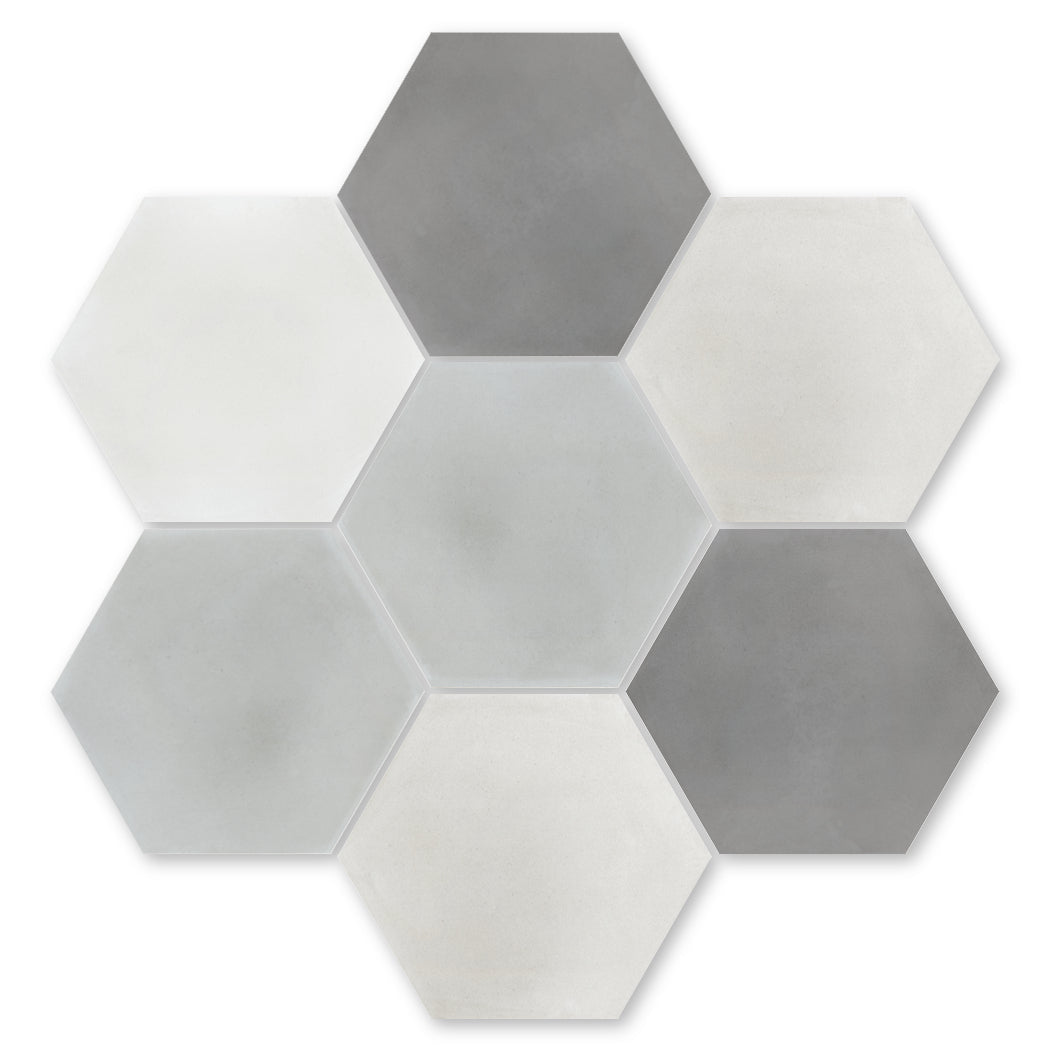 The Solid Hex-Mixed Grey Sample by New York Cement Tile: seven hex tiles in mixed grays and white, honeycomb pattern.