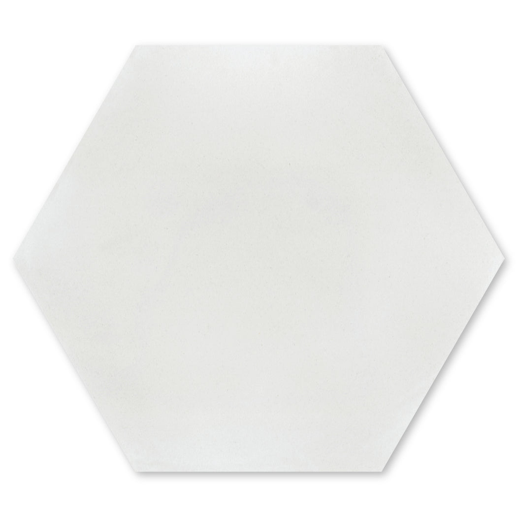 A grey hexagon tile from New York Cement Tile, Solid Hex-Mixed Grey, Extra Sample.