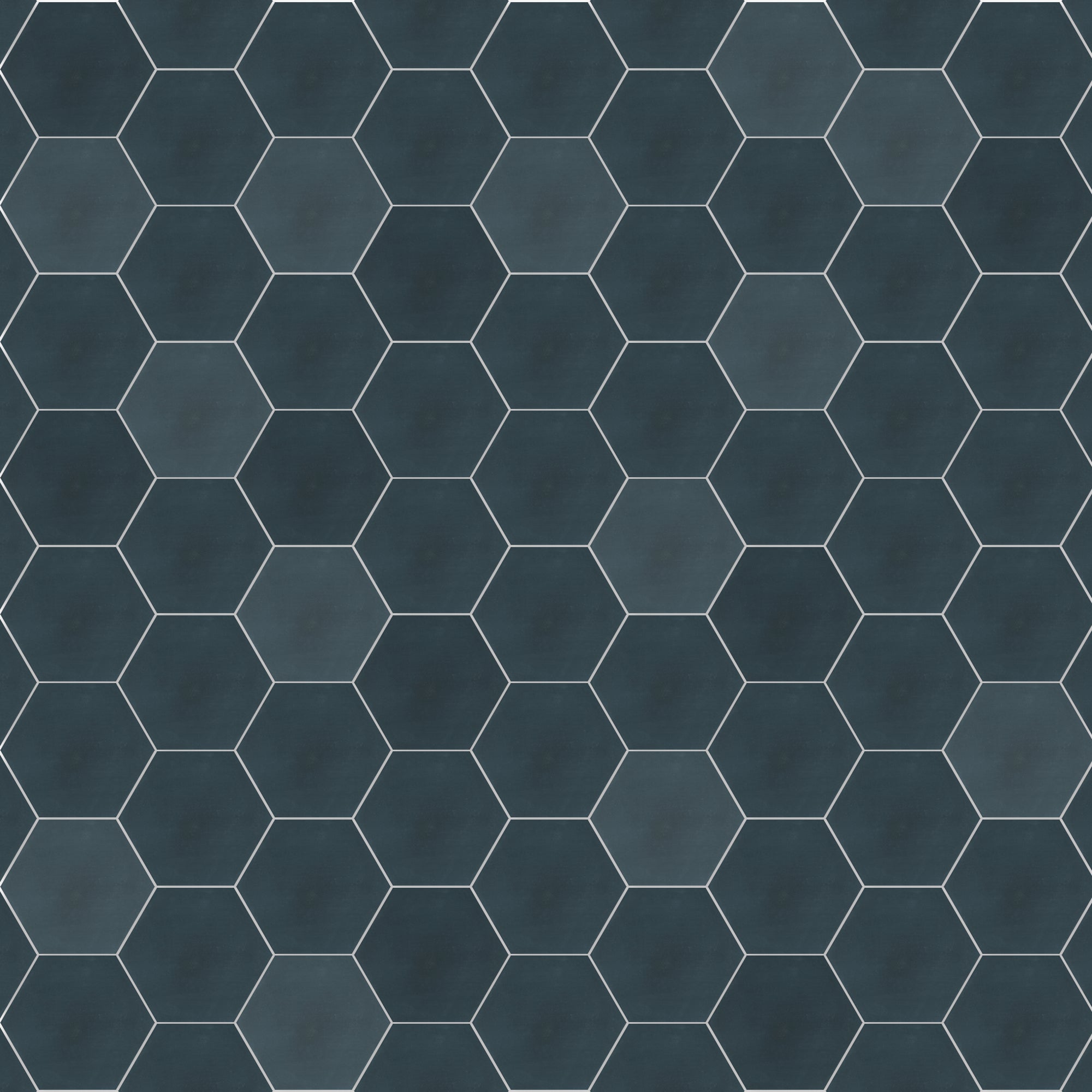 Solid Hex-Navy sample tiles by New York Cement Tile in a honeycomb pattern with thin white grout lines.