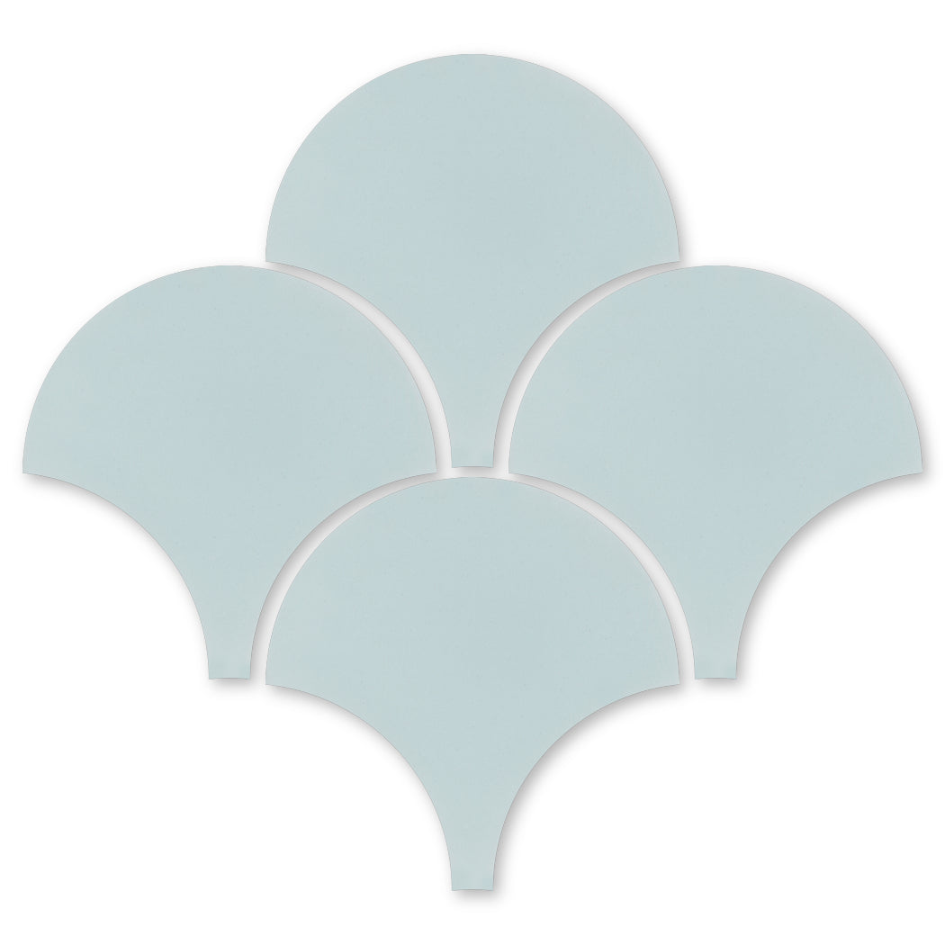 Five light blue NF20-440 Fishscale tiles by New York Cement Tile, arranged in a flower pattern on white background.