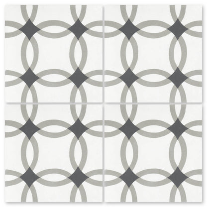 The N20-255 Extra Sample by New York Cement Tile has four tiles with a gray and black geometric circle design on white.