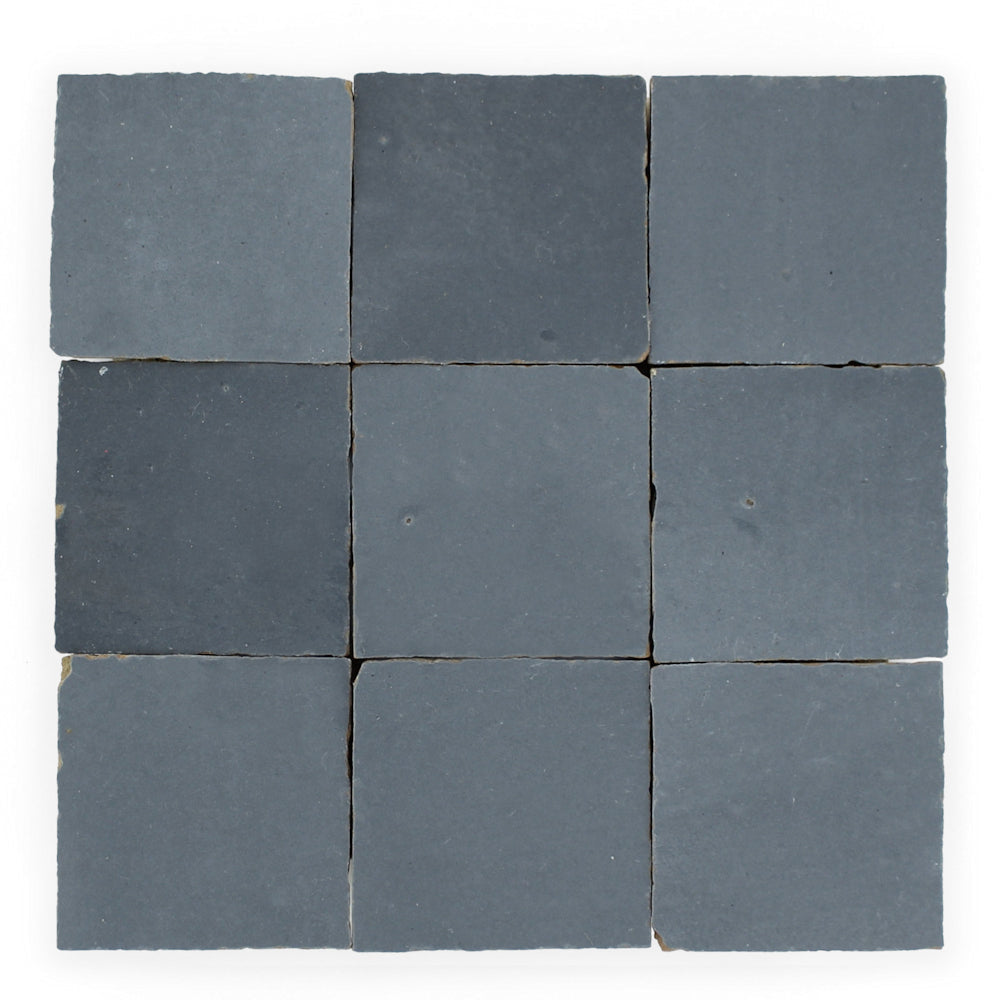 Nine Ash Grey 2X2 tiles by New York Cement Tile, arranged in a 3x3 grid on a white background.