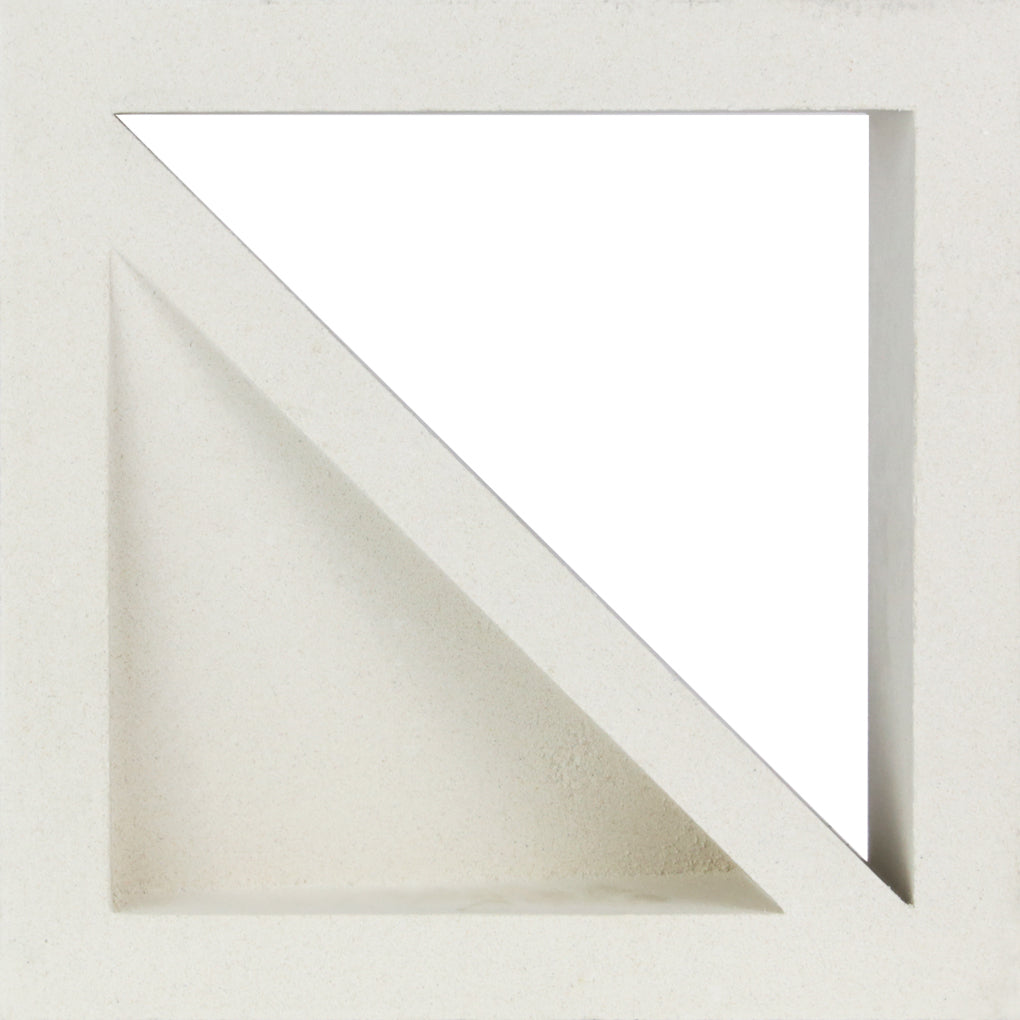 Large Bermy Sample by New York Cement Tile: a white breeze block with diagonal cut, creating a triangular decorative opening.