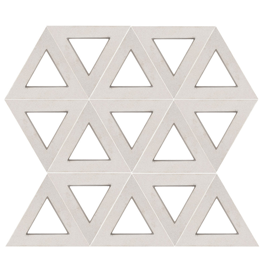 Nui Triangular by New York Cement Tile features beige hexagons with cut-out triangles, inspired by mid-century breeze blocks.