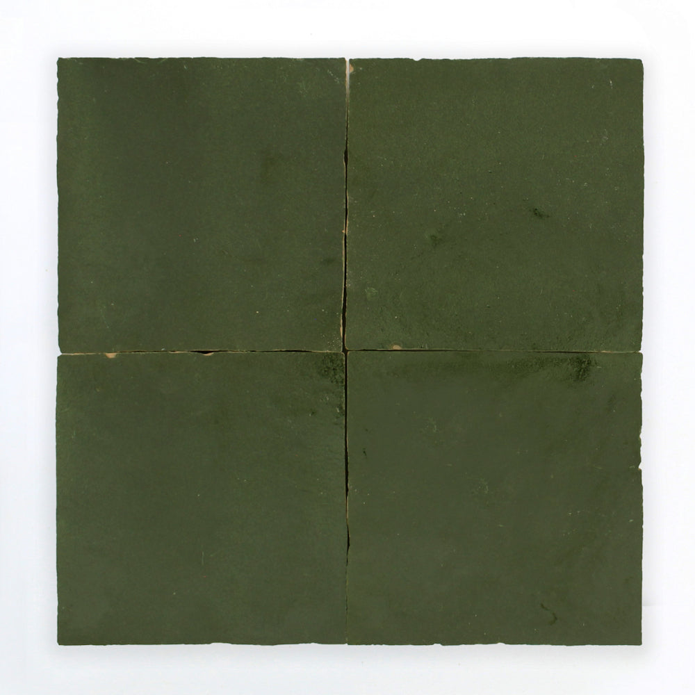 Four matte Moss Green zellige tiles by New York Cement Tile in a grid on white, with slight gaps between them.