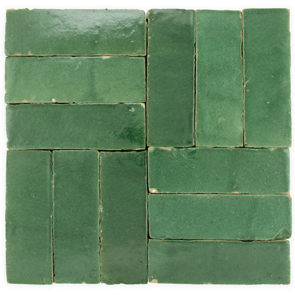Forest Green (2x6) Zellige tiles by New York Cement Tile in a geometric layout with visible grout between each tile.
