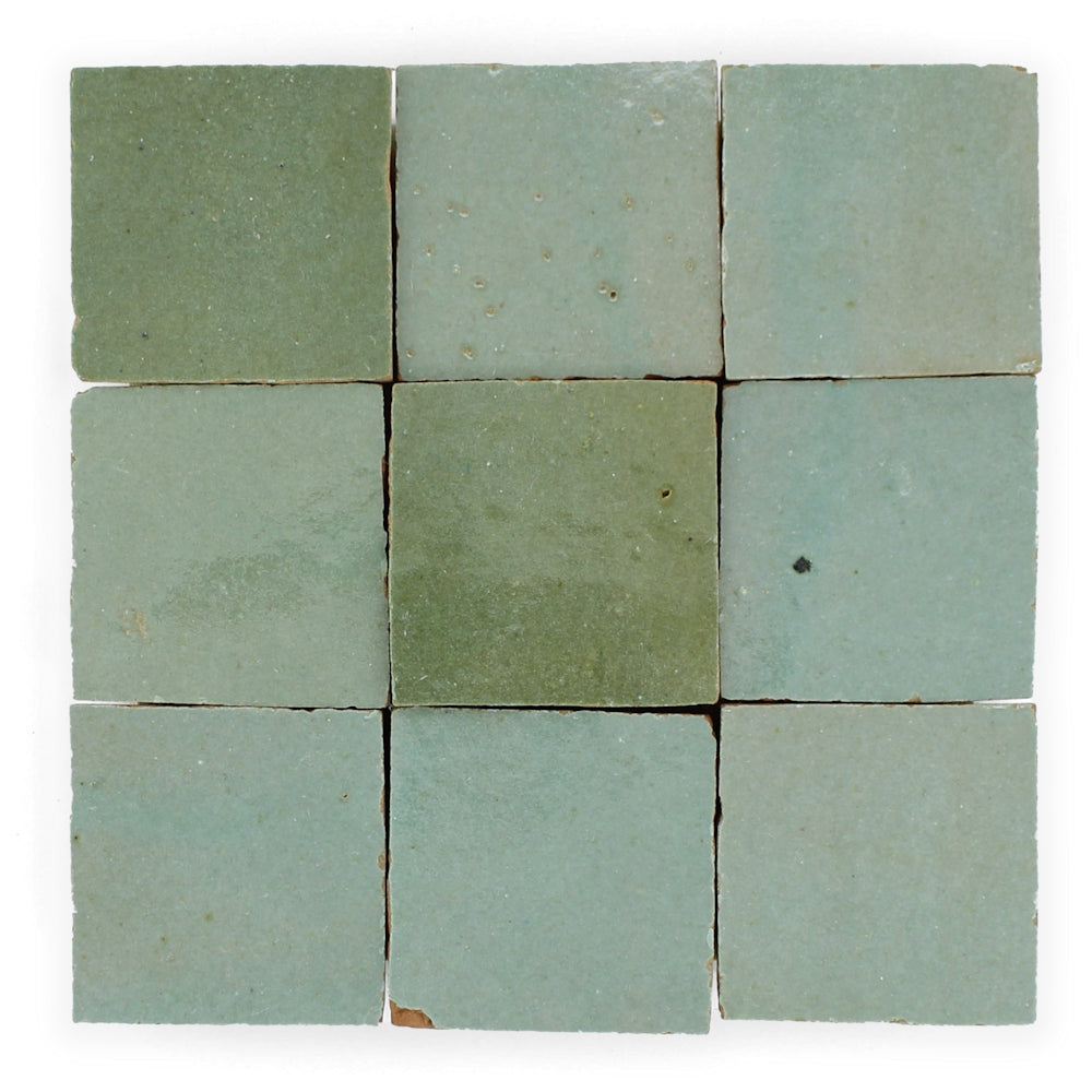 Nine Leafy Green Sample tiles by New York Cement Tile, each unique in shade and handcrafted texture, arranged in a grid.