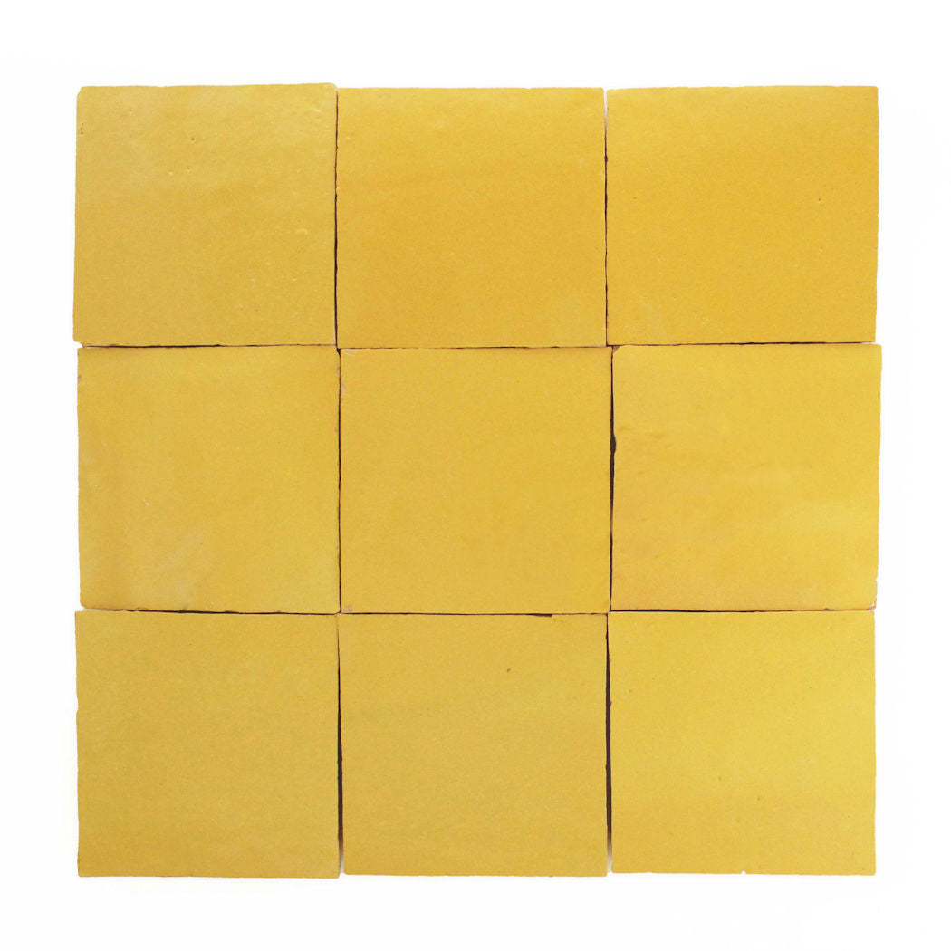 Nine Sunflower Yellow 2X2 tiles by New York Cement Tile arranged in a 3x3 grid on a white background.