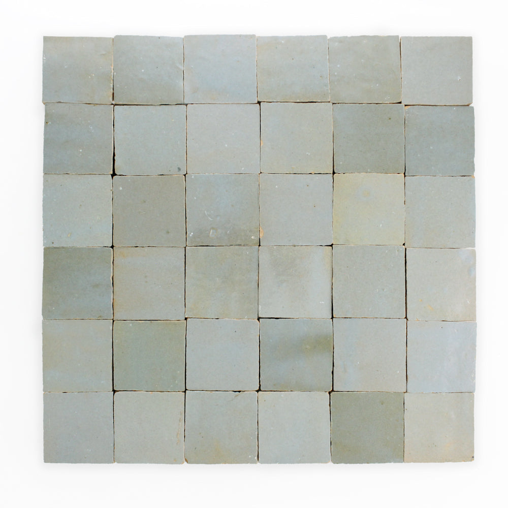 Square grid of 36 Arctic Blue2X2 tiles by New York Cement Tile arranged evenly on a white background.