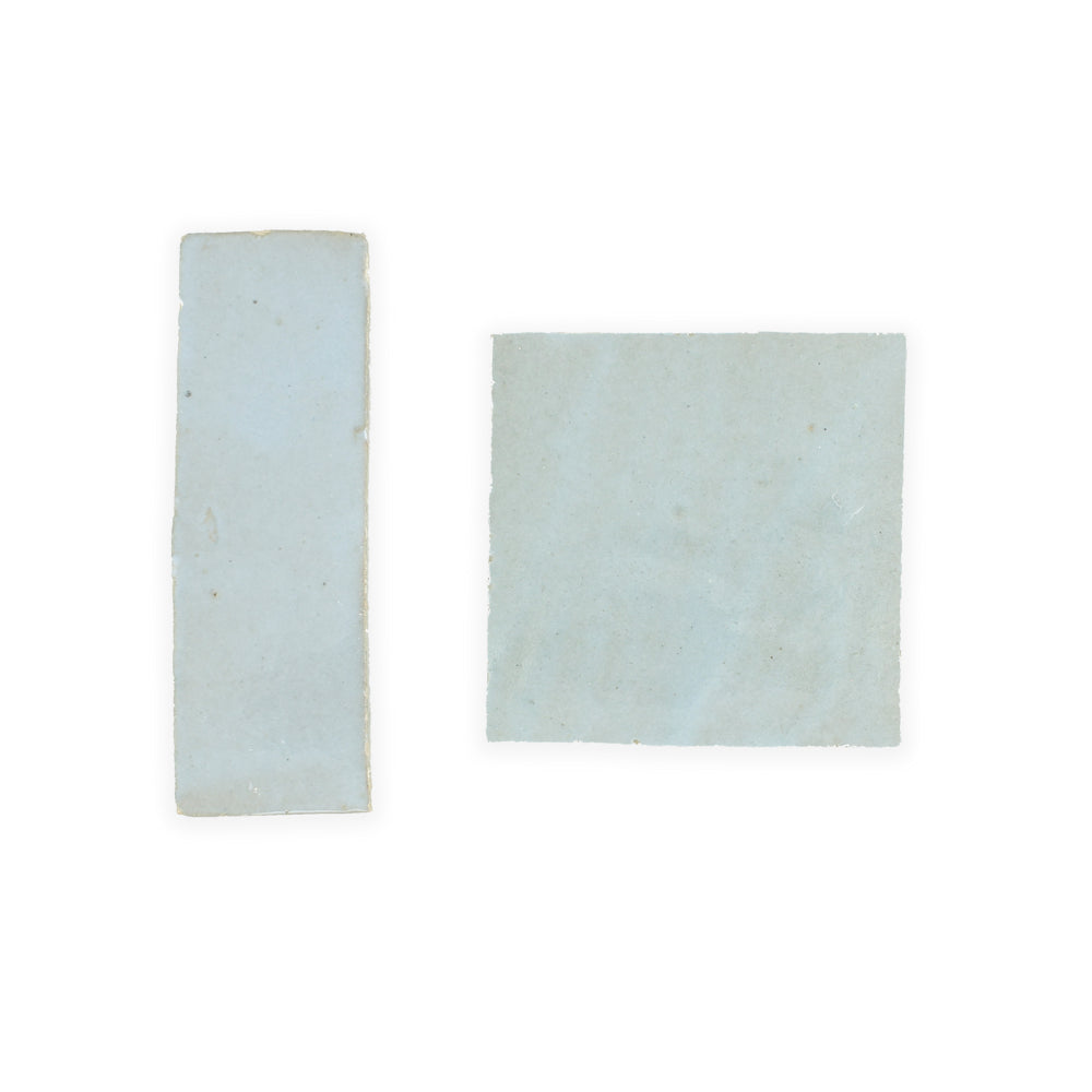 Two Arctic Blue (2x6) tiles by New York Cement Tile—one square, one rectangle—on a white background.