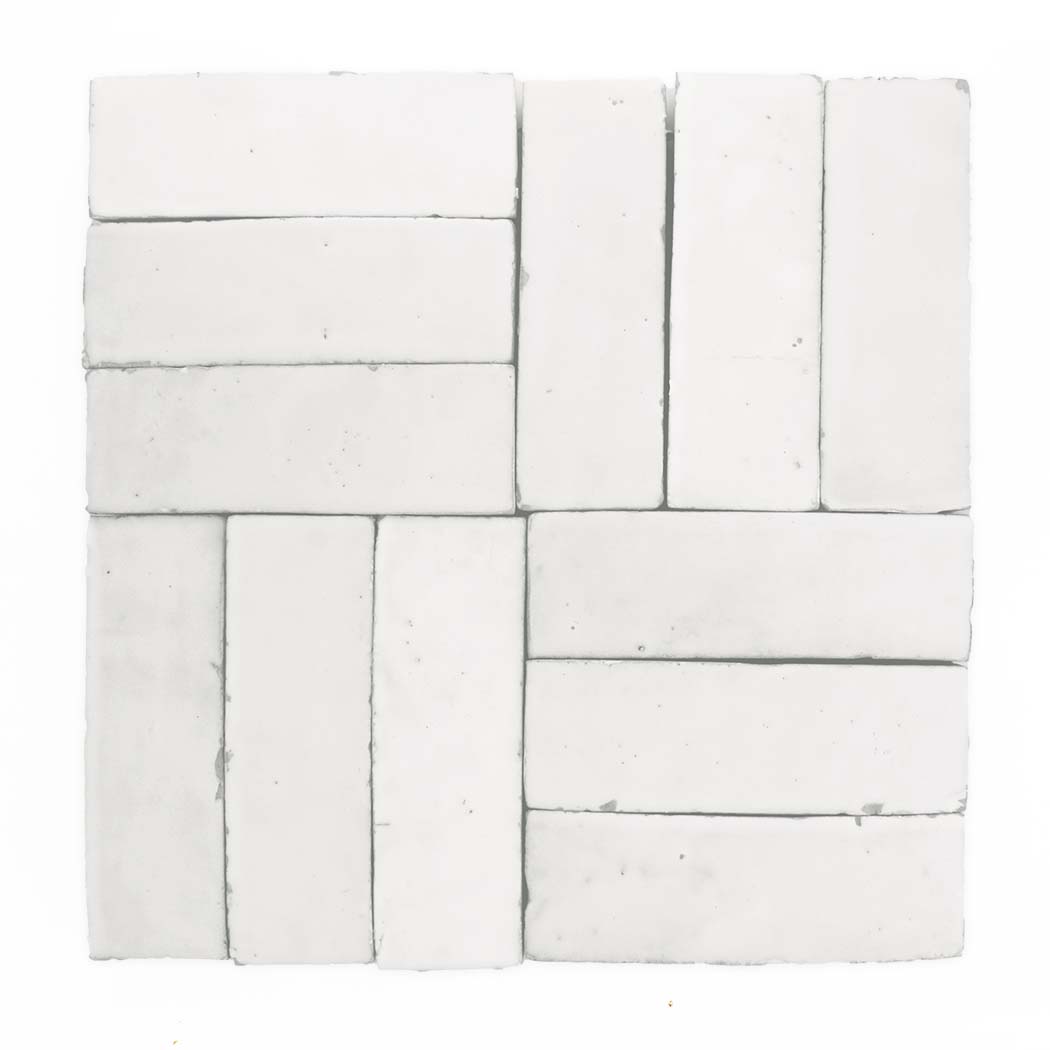 Nine Ivory Cloud (2x6) tiles by New York Cement Tile in a geometric basketweave on a white background.