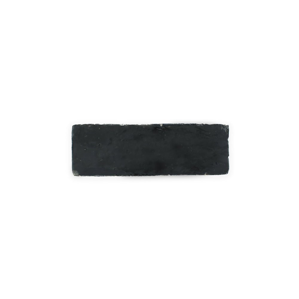 A Black Onyx (2x6) tile by New York Cement Tile is centered on a plain white background.