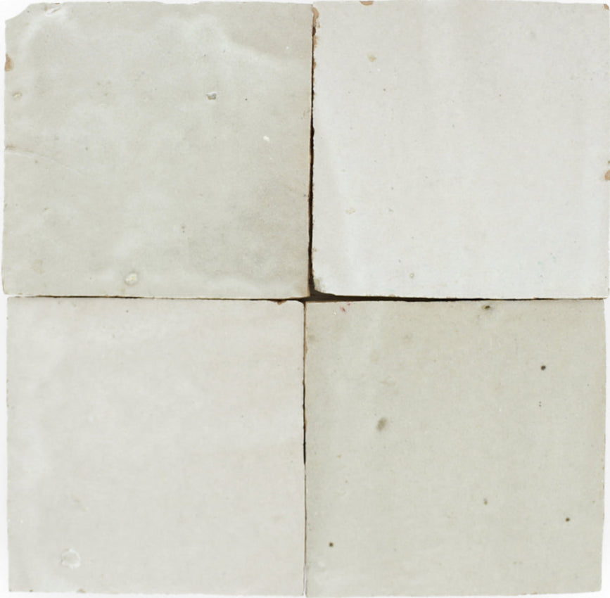 Four Pearl Grey tiles by New York Cement Tile, off-white with subtle texture and unique imperfections in a 2x2 grid.