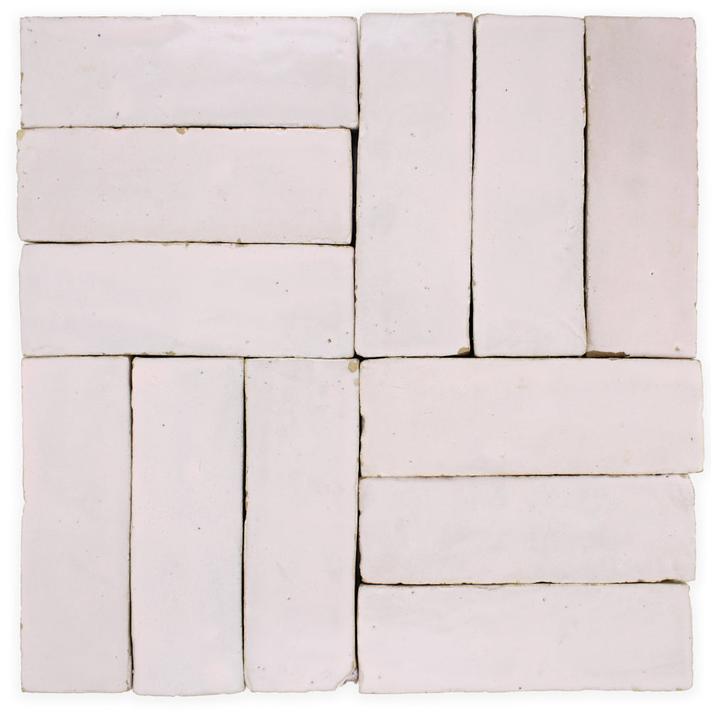 Rosy Pink (2x6) tiles by New York Cement Tile: pale, handcrafted, laid in geometric alternating vertical/horizontal pattern.
