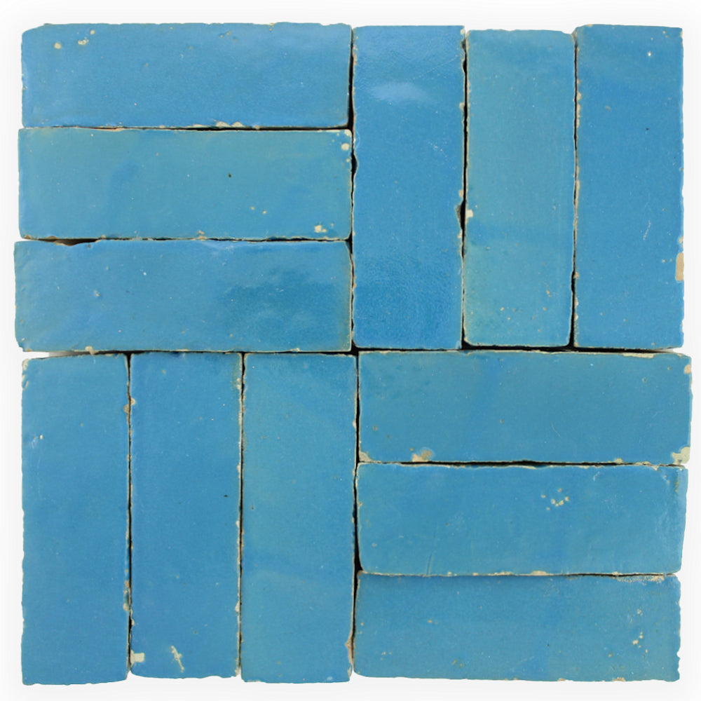 Azure (2x6) tiles by New York Cement Tile in a grid, some with slight edge chips and imperfections. Extra sample available.