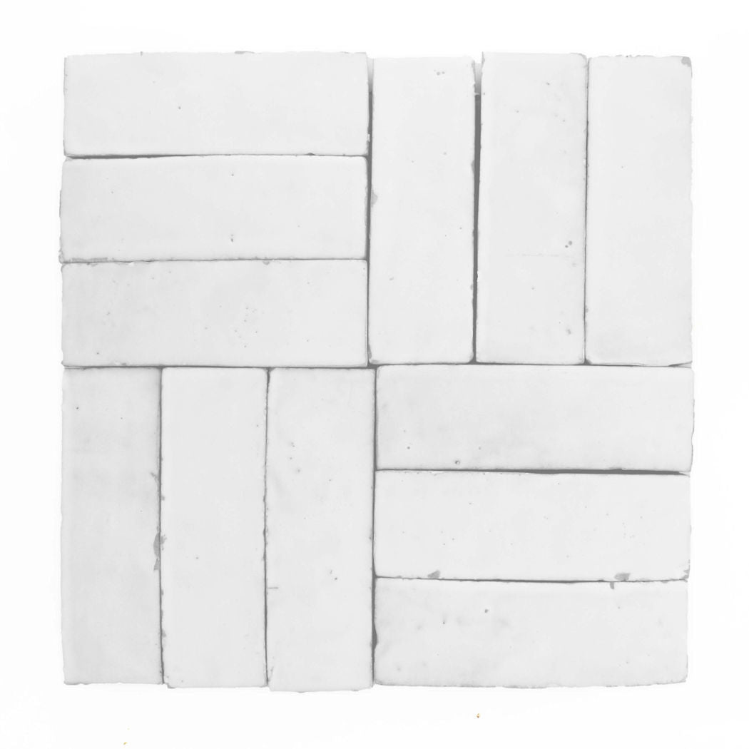Twelve Frost (2x6) tiles by New York Cement Tile in a geometric, interlocking square pattern on a plain background.