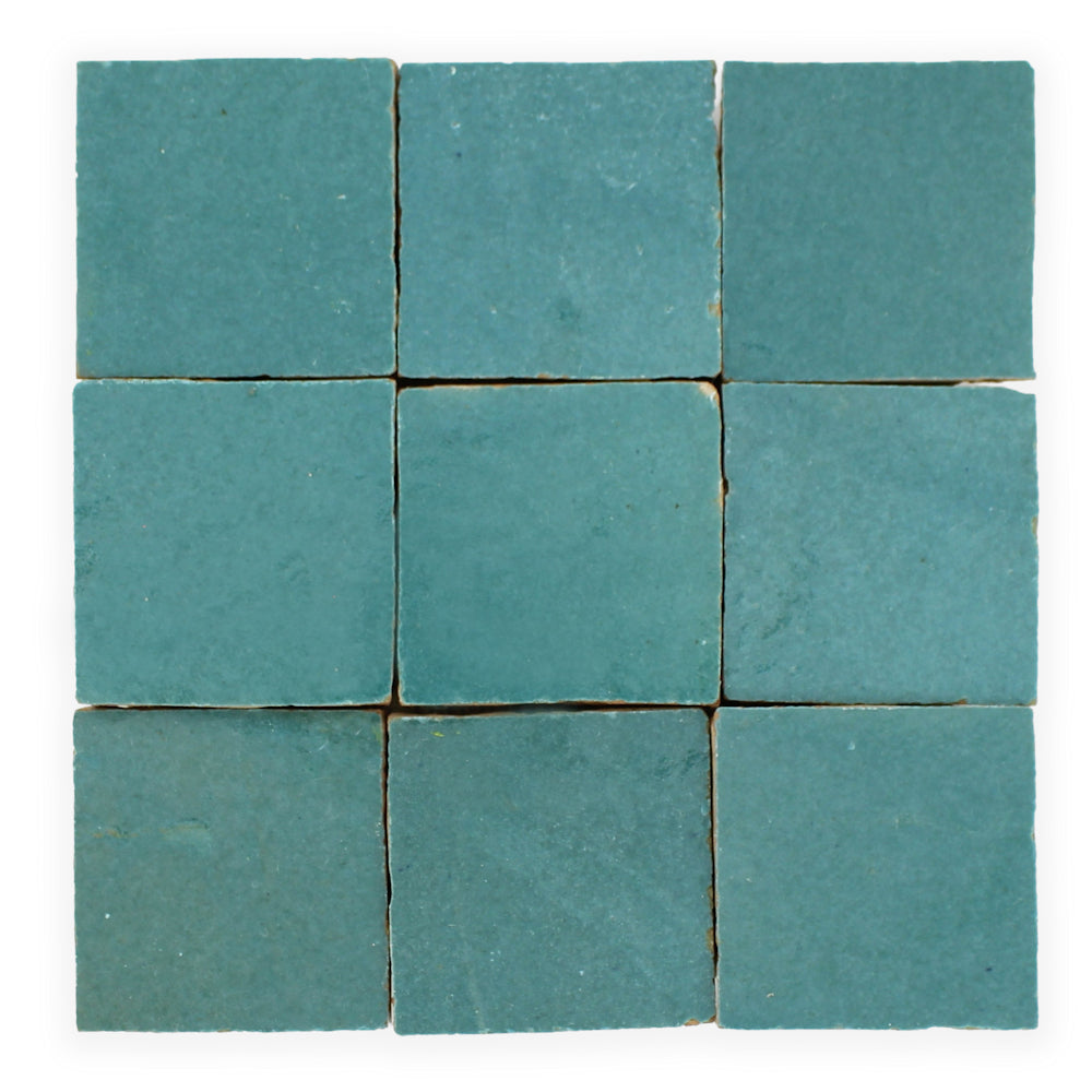 Nine Water line 2X2 tiles by New York Cement Tile in teal, matte, and slightly textured, arranged in a 3x3 grid.
