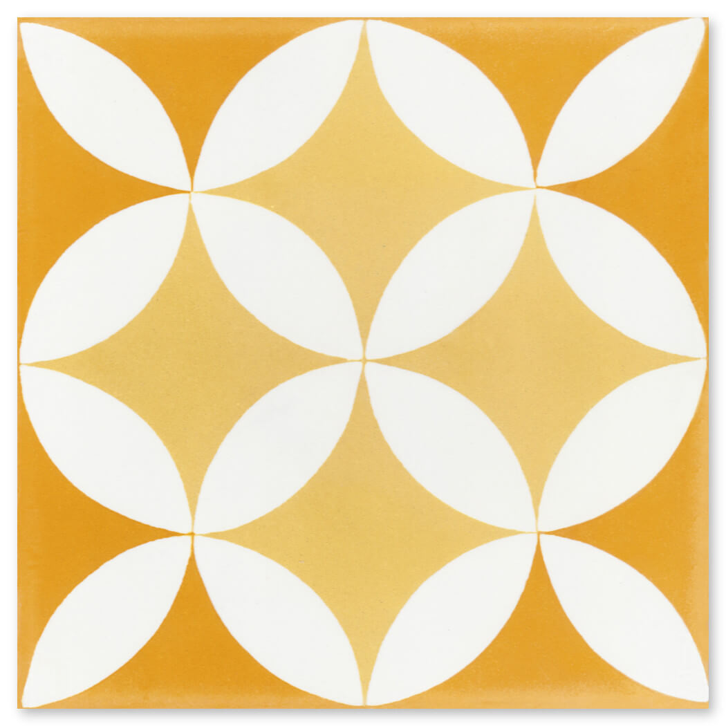 N20-062 7704/10 Extra Sample by New York Cement Tile: yellow tile with a white geometric petal pattern.