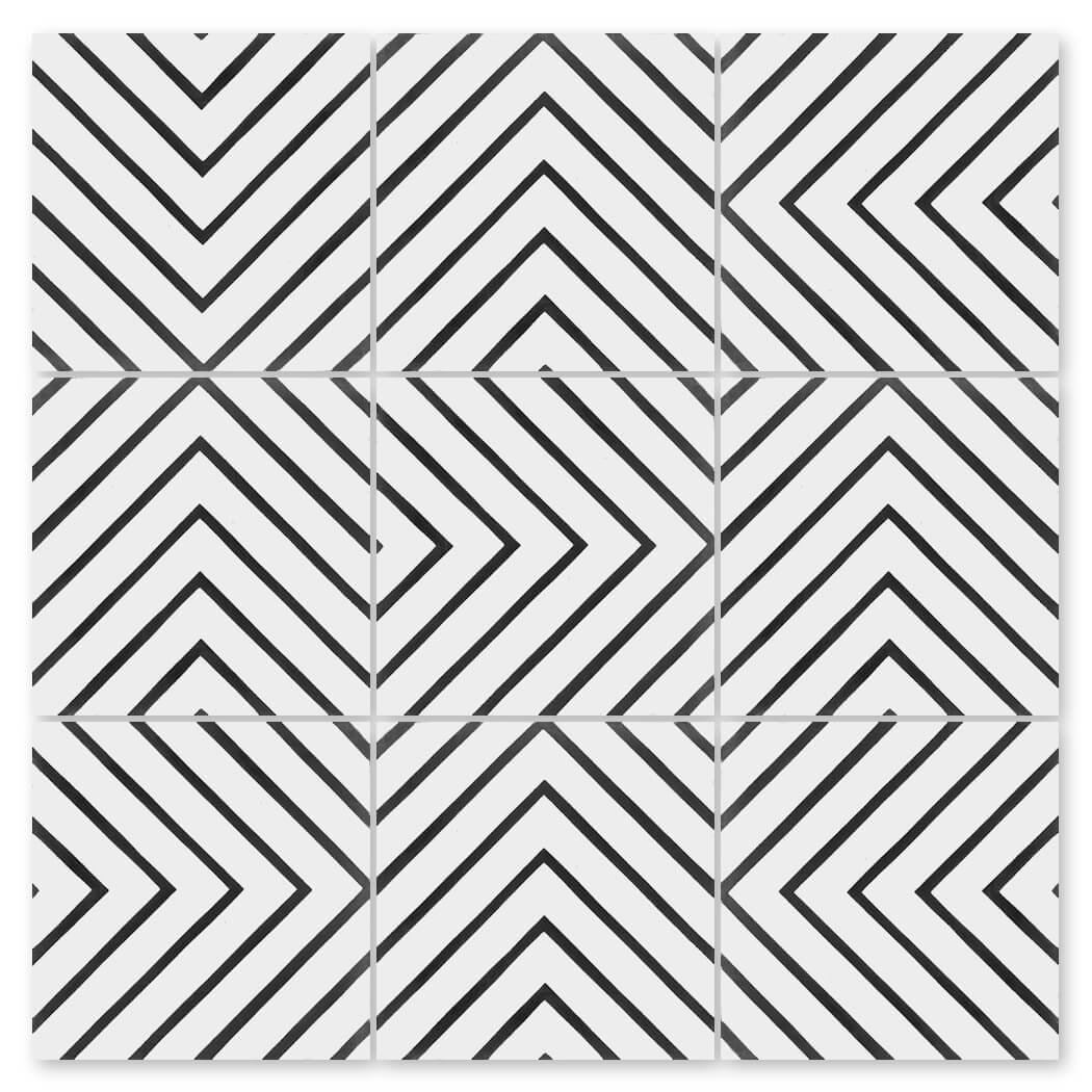 Nine N20-437 B&W tiles by New York Cement Tile feature black chevrons for a bold, geometric arrow pattern.
