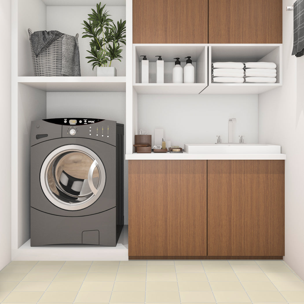 Modern laundry with front-load washer, sink, wood cabinets, shelves, and 1103-Solid 4X4 tiles by New York Cement Tile.