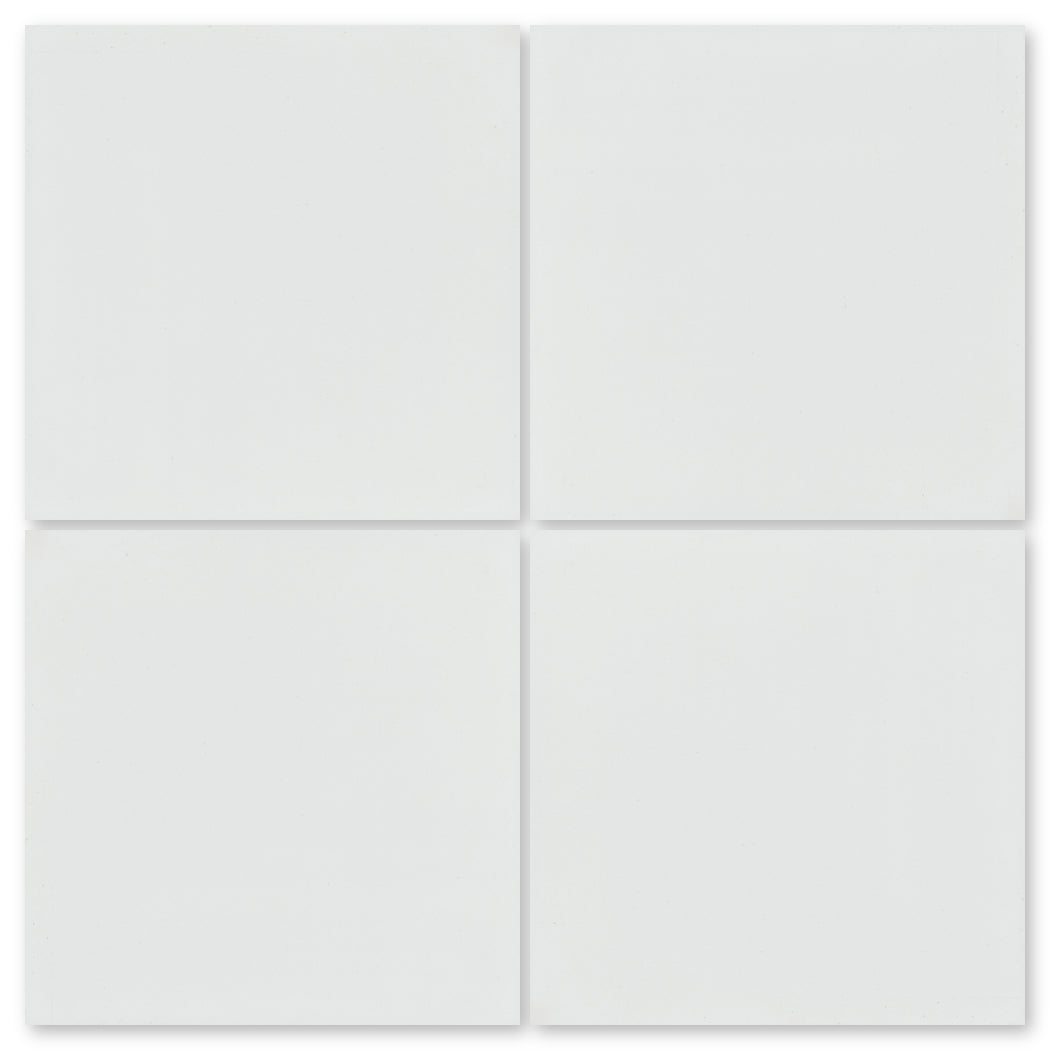 Four 8x8 solid white cement tiles by New York Cement Tile, arranged 2x2 to show subtle handcrafted detail.