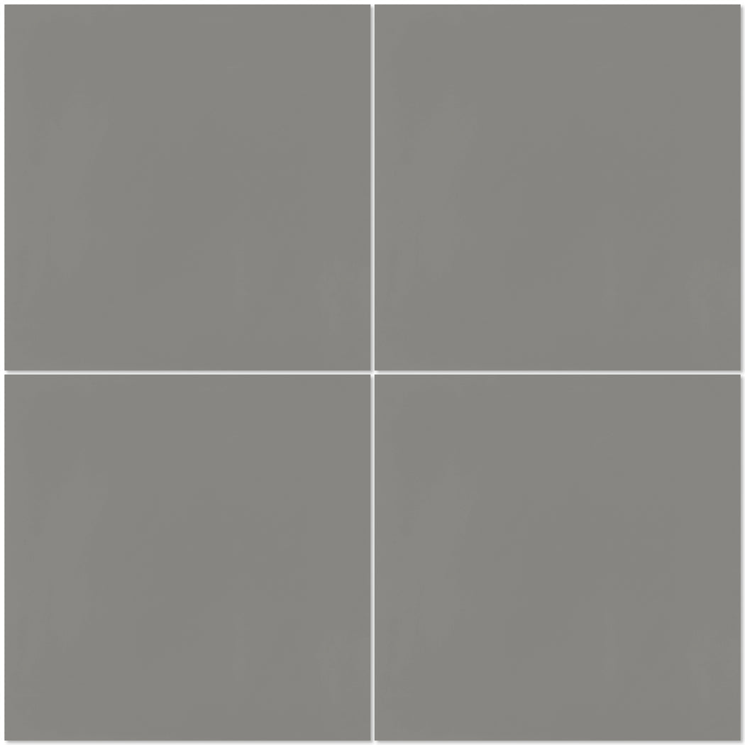 Four evenly spaced grey 2202-Solid 4x4 tiles by New York Cement Tile on white, evoking handcrafted cement charm.