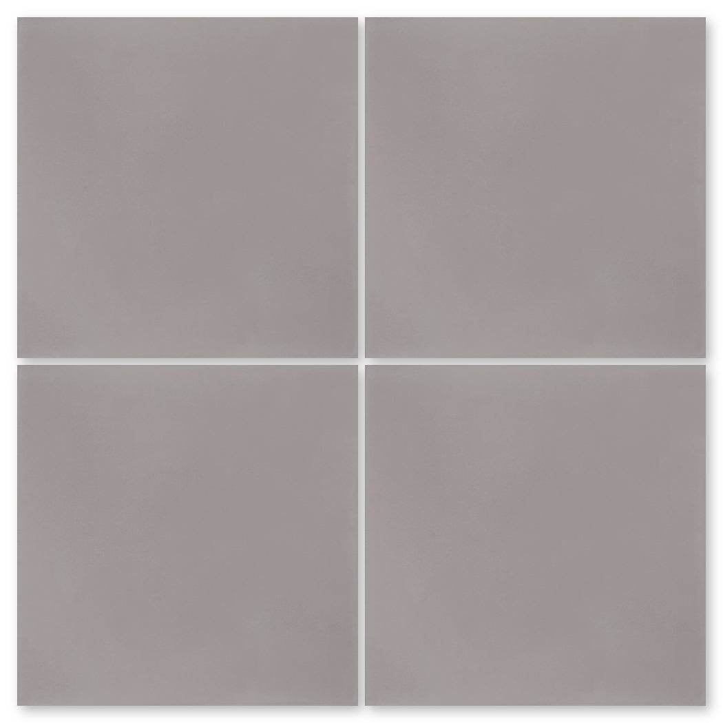 The 2201-Solid 4X4 sample by New York Cement Tile features four matte grey tiles in a grid with thin white grout lines.