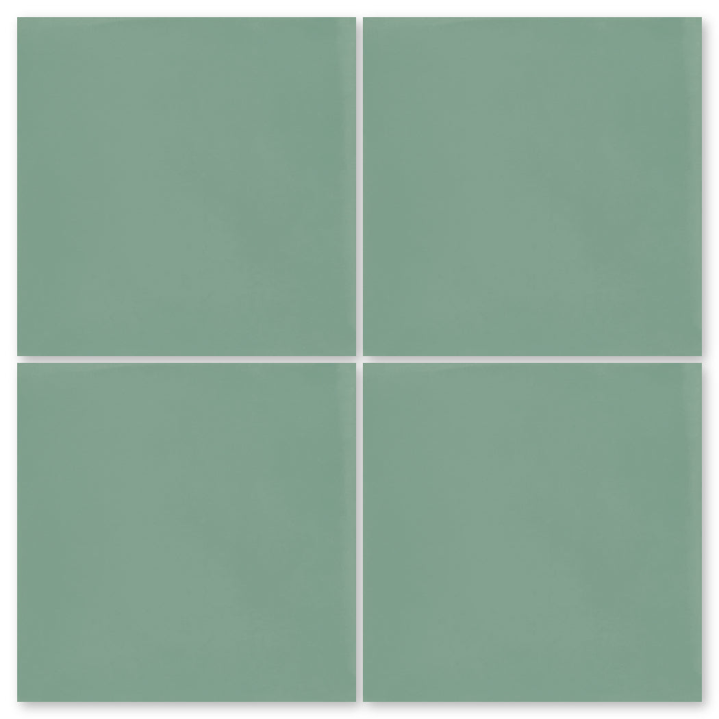 Four sage green 3327-Solid 4x4 tiles by New York Cement Tile, matte finish, arranged in a 2x2 grid on white.