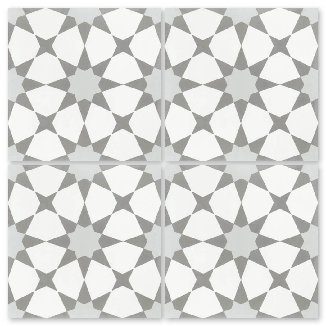 N20-271 Silver Sample by New York Cement Tile: four square gray and white geometric tiles with handcrafted star designs.