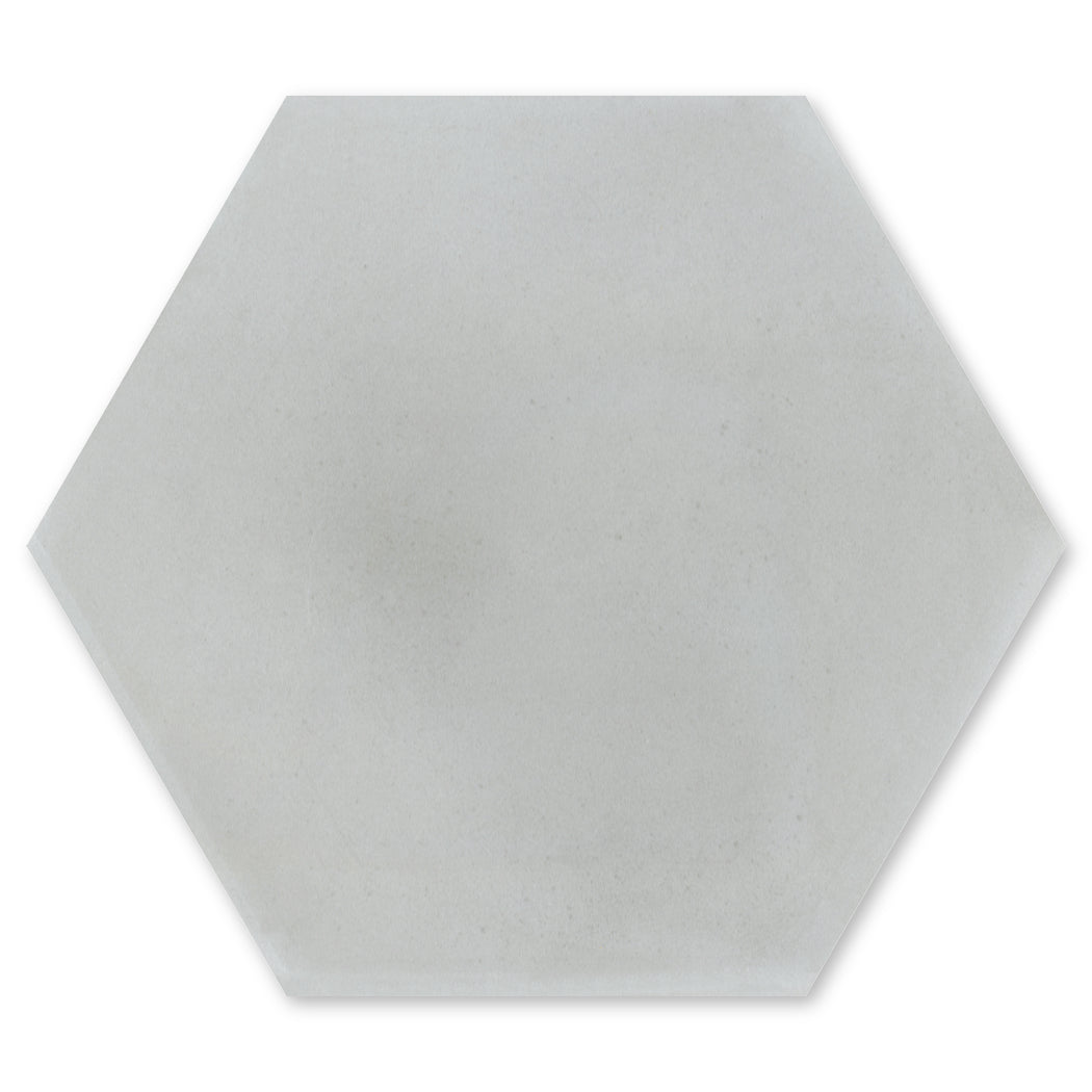 Solid Hex - Mixed Grey by New York Cement Tile: a smooth, light grey hexagon tile with beveled edges and slip resistance.
